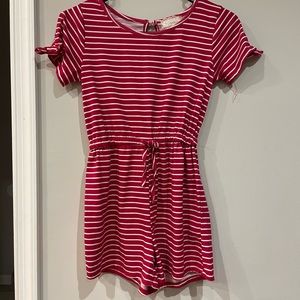 This is a red large kid romper by between